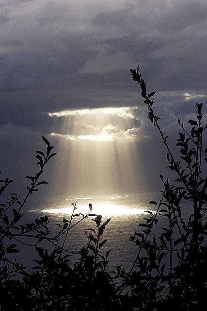 Light shining through the clouds representing the light within us that shines through our clouded minds.